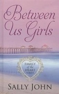 Cover: Between Us Girls - Thorndike Press