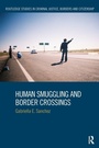 Cover: Human Smuggling and Border Crossings - Routledge