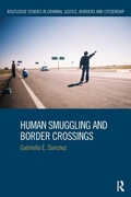 Cover: Human Smuggling and Border Crossings - Routledge