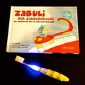Cover: ZABULI-DER ZAUBERDRACHE / ZABULI - DER ZAUBERDRACHE (Bilderbuch + Zahnb&uuml;rste) - Effecteve Verlag
