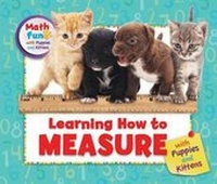 Enlarge image Cover: Learning How to Measure with Puppies and Kittens - Enslow Publishing