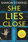 Cover: She Lies Close - Titan Books Ltd