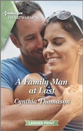 Cover: A Family Man at Last - Harlequin
