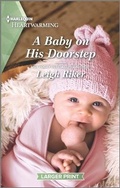 Cover: A Baby on His Doorstep - Harlequin Heartwarming Larger Print