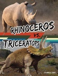 Cover: Rhinoceros vs. Triceratops - Capstone Press