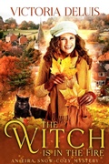 Cover: The Witch is in the Fire (An Eira Snow Cozy Mystery, #3) - Victoria DeLuis